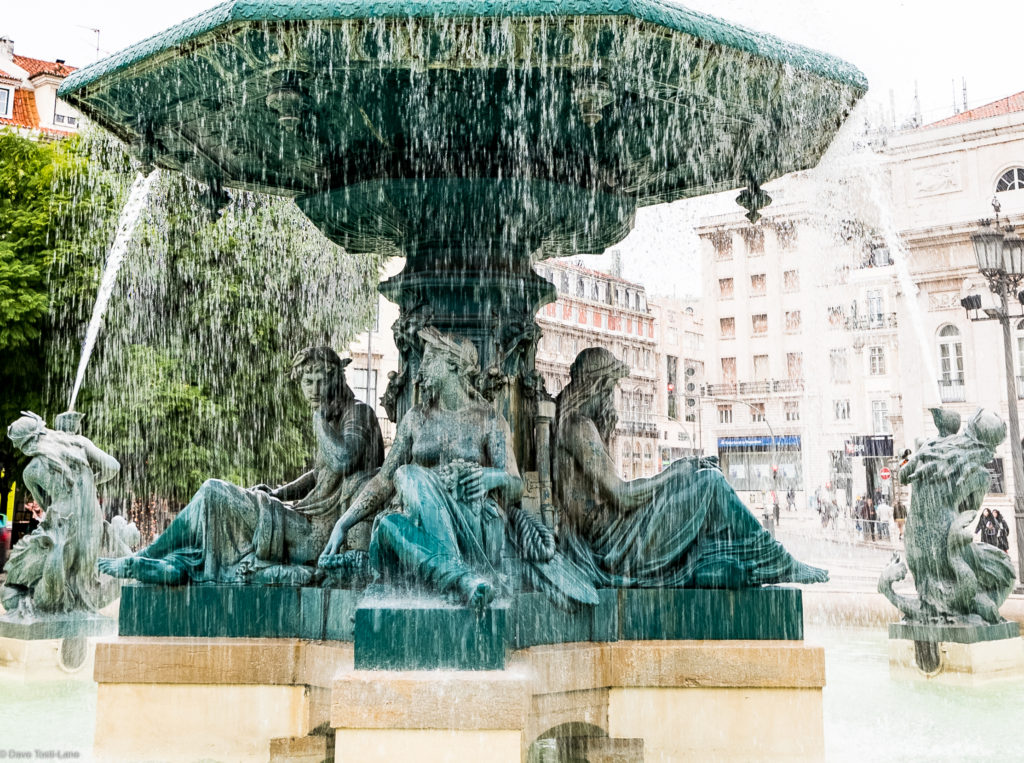 The ladies who sit under the fountain.